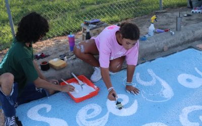 students painting parking spots