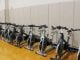 The spin bikes the Lifetime Fitness and Wellness class uses are lined against the walls of the gym.