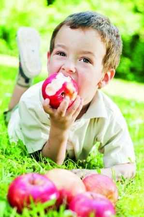 Boy Outside Eating an Apple (1)