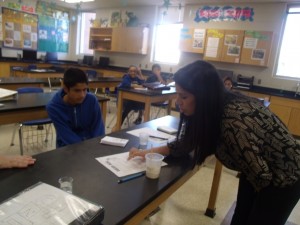 Mrs.Santos is helping her students