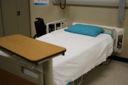 A hospital bed in the health room allows for students to practice hospital procedures.