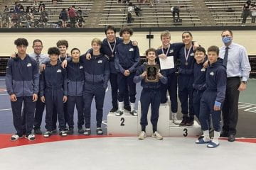 Wrestlers standing for a group picture after regionals at the Blossom Athletic Center (Picture by Julian Guerra)
