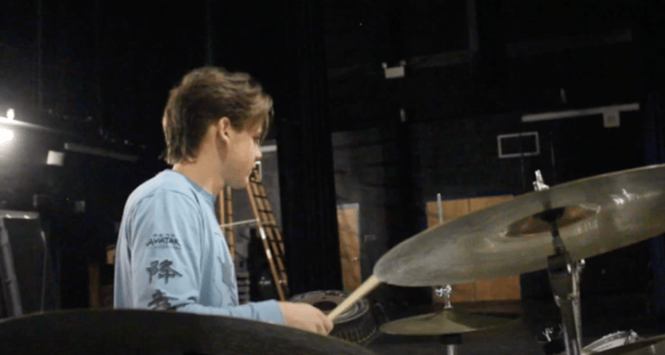 Nolan Klein plays the drums at the student concert