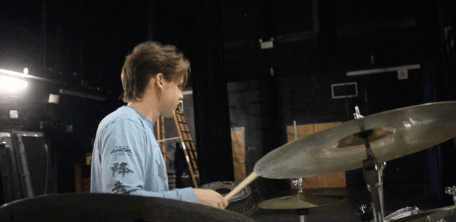 Nolan Klein plays the drums at the student concert
