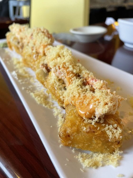 The Sushi Express Roll, tempura fried and topped with spicy mayo and crumbs