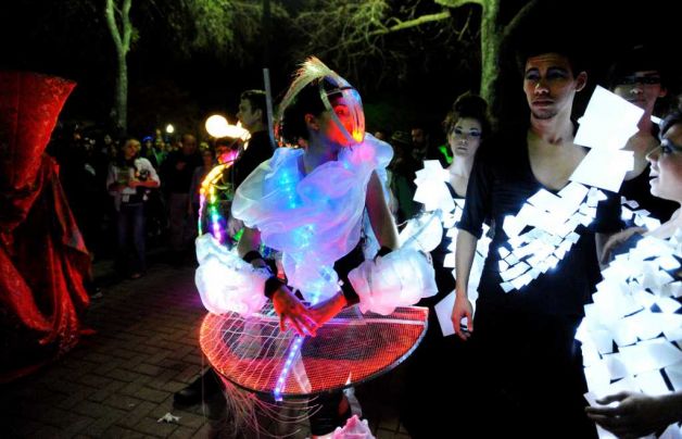 Ivonne Perea (left) a student at San Antonio College, joins her architecture classmates during Luminaria in Hemisfair Park on Saturday, March 12, 2011