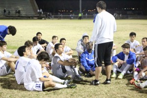 Coach Simmons gives the team a good pep talk after their 2-0 victory. Photo by Jacob Dukes