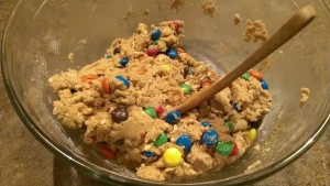 Do your best to thoroughly distribute the M&Ms and peanuts through the dough, that way you can have M&Ms and peanuts in every cookie.