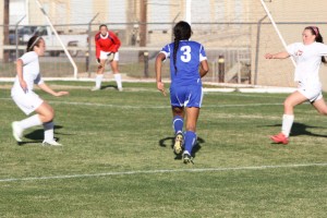 Ana Campa, 10, attacks the goal midst two defenders. Photo by Jacob Dukes 