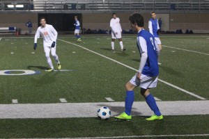 Junior defender Chris Flood searches for a teammate. Photo by Jacob Dukes