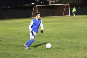 Junior Chandler Farnsworth dribbles the field.  Photo by Jacob Dukes