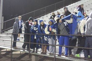 Members of the girls soccer team come to the game to cheer on the boys soccer team. Photo by Jacob Dukes
