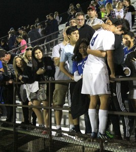 Senior Parker Miller hugs Churchill friend and former teammate Quentin Perez after the game. Photo by Jacob Dukes