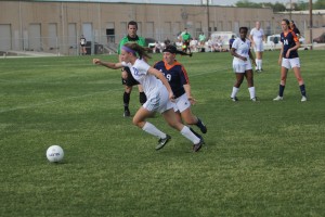 Junior forward Kyra Falcone evades a Brandeis defender. Photo by Jacob Dukes