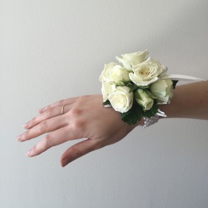 It is a prom tradition to get your date a corsage, so be sure to do that. Photo by vivaflowerstore.com