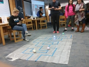 students decoding a robot. by Hope Herrera