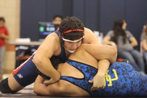 Abram Guardiola restrains his opponent from Clemens. He is one of five regional qualifiers. Photo by Allison Boerger
