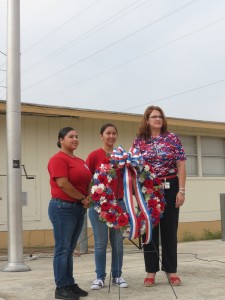 Cadet Lieutenant Colonel Samantha Bakaysa, Cadet Major Phylisha Estrada, and Ms. Murach placed a wreath in front of the American flag.
