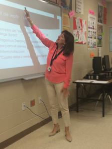 Spanish teacher Lisa Alanis gives a lesson using her microphone. 